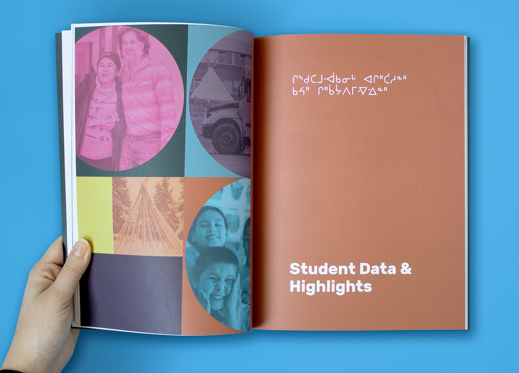 CSB_201920_Body-7 A person holds open a booklet. The left page shows circles with photos of smiling people and a teepee. The right page has white text in Indigenous syllabics and English reading “Student Data & Highlights” on a brown background.