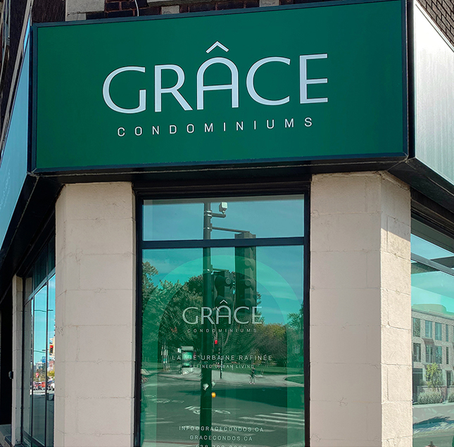 A storefront with a green sign that reads