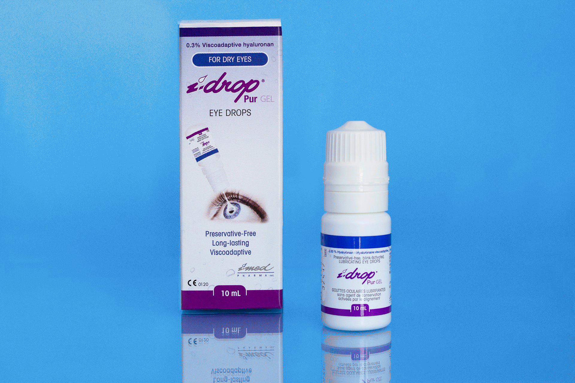 IMed_3 A white container with blue text and purple text on it next to a box.