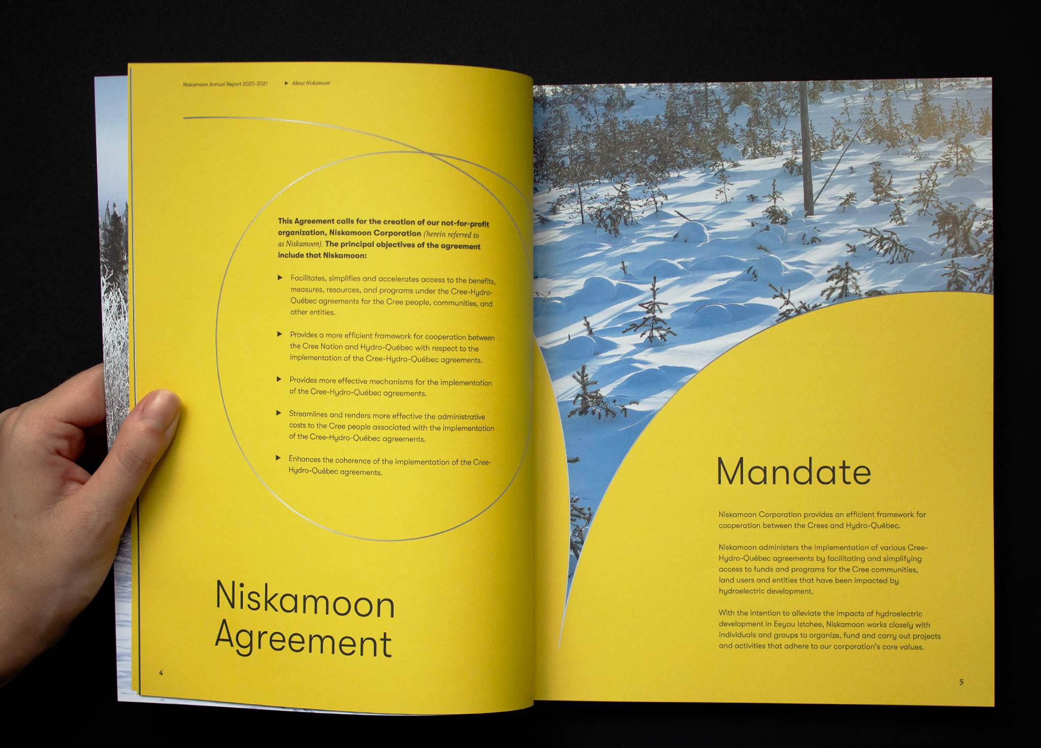 Niskamoon_202021-5 A hand holds open a booklet with yellow pages. The left page is titled