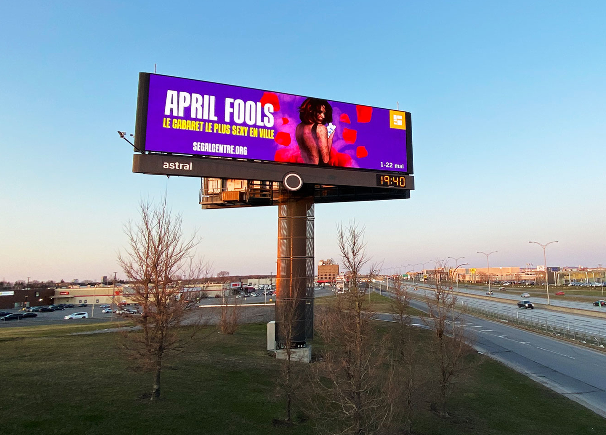 Segal_202122-5 A large roadside billboard displays an ad for