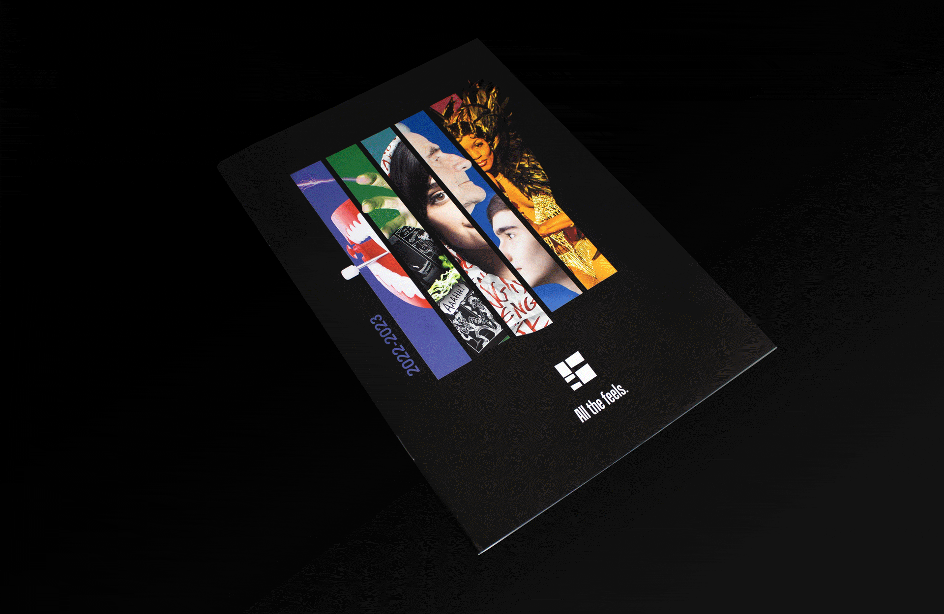 Segal_202223-4 A booklet with a black cover featuring vertical strips of colorful artwork and photos, labeled