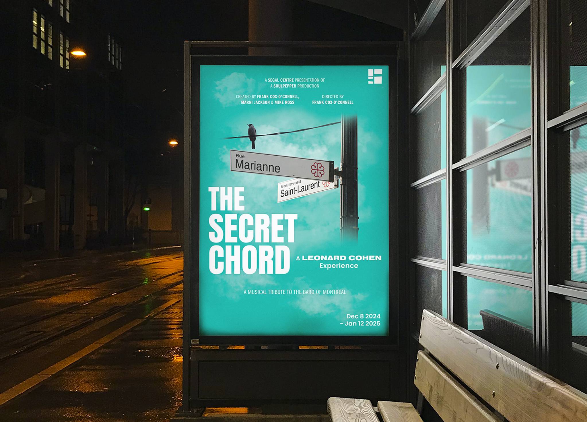 Segal_202425-5 A backlit bus stop poster at night displays