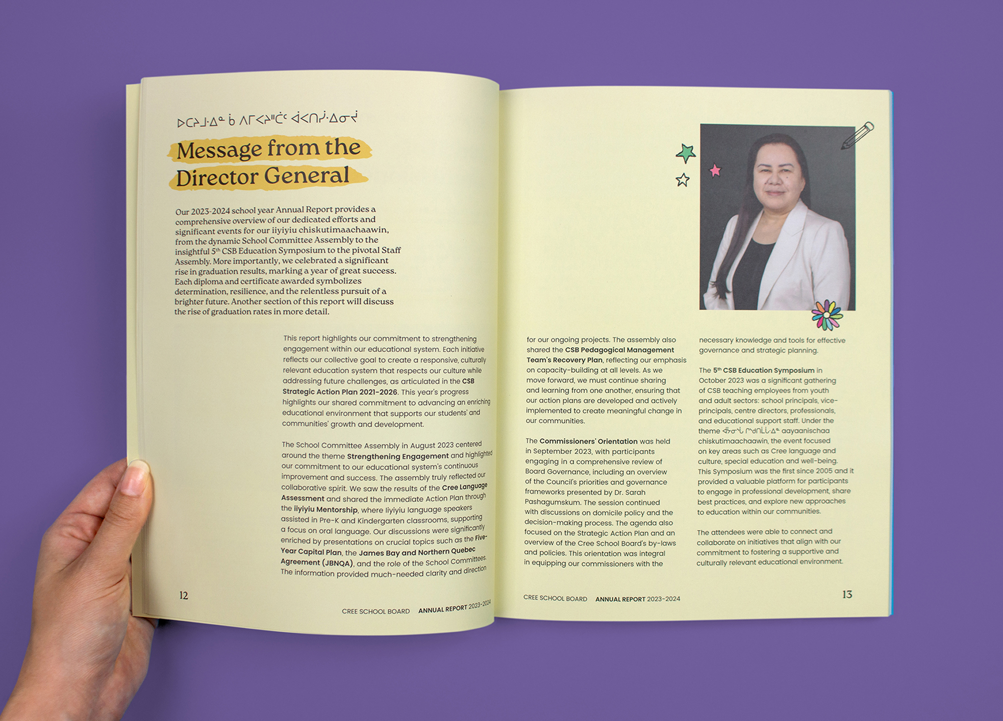 An open annual report displays two pages. The left page features a “Message from the Director General” with highlighted text. The right page shows a portrait of a woman in business attire with small decorative stars around her photo.