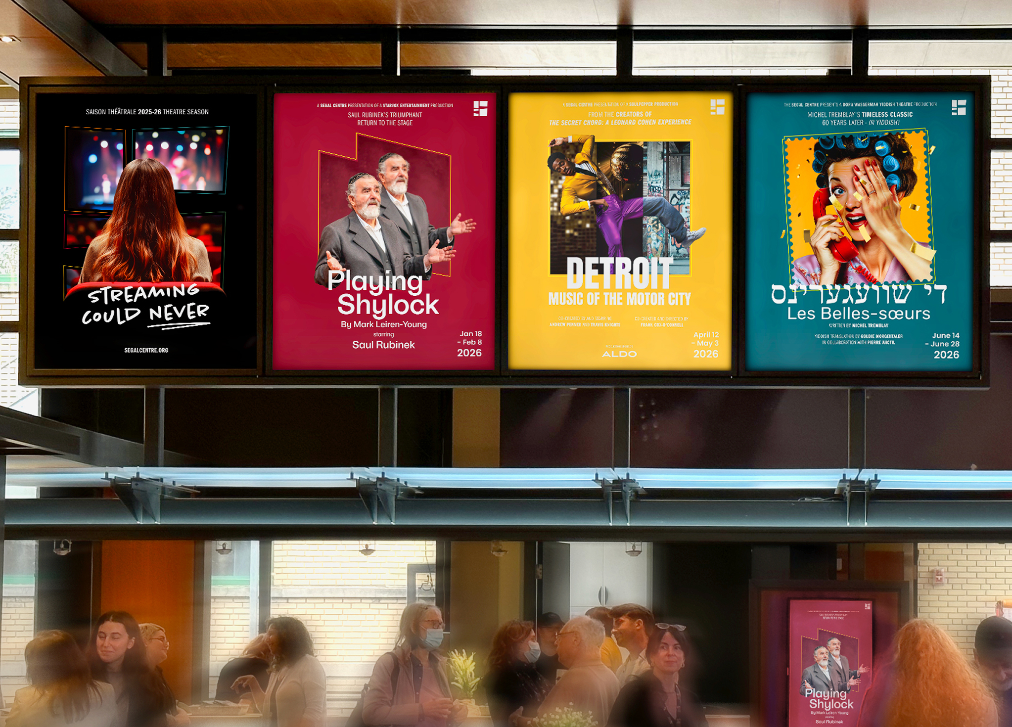 Four colorful theatre posters hang above a busy lobby with blurred people below. The posters advertise shows: