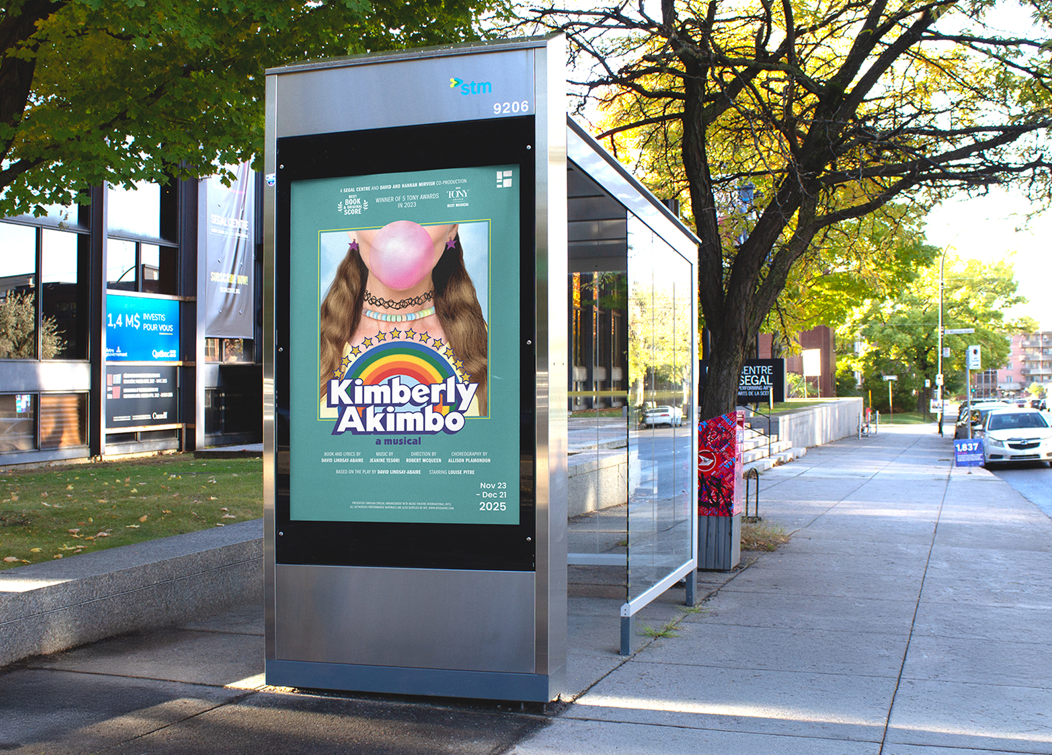 A bus shelter displays a poster for the musical